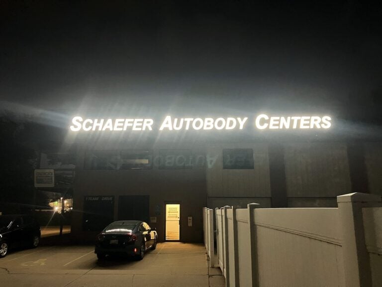Channel letter sign for Schaefer Autobody Centers in O'Fallon, MO, illuminated at night