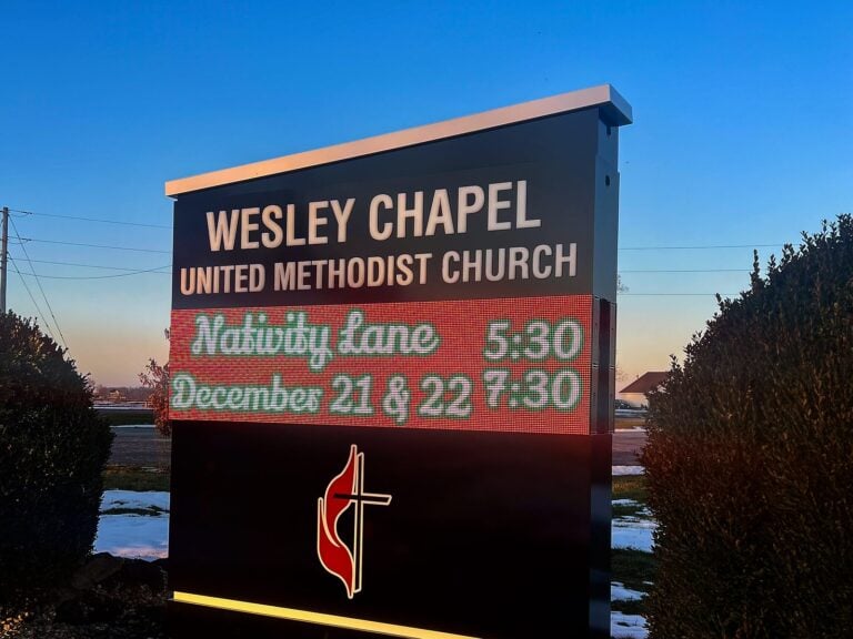 LED message center for Wesley Chapel United Methodist Church in Jacksonville, IL, illuminated at night