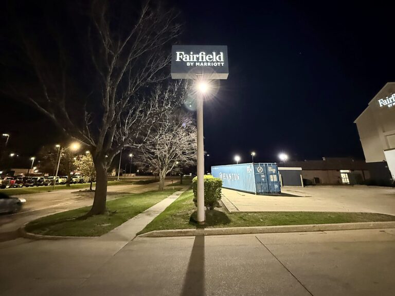 Pylon sign for Fairfield by Marriott in Champaign, IL, illuminated at night