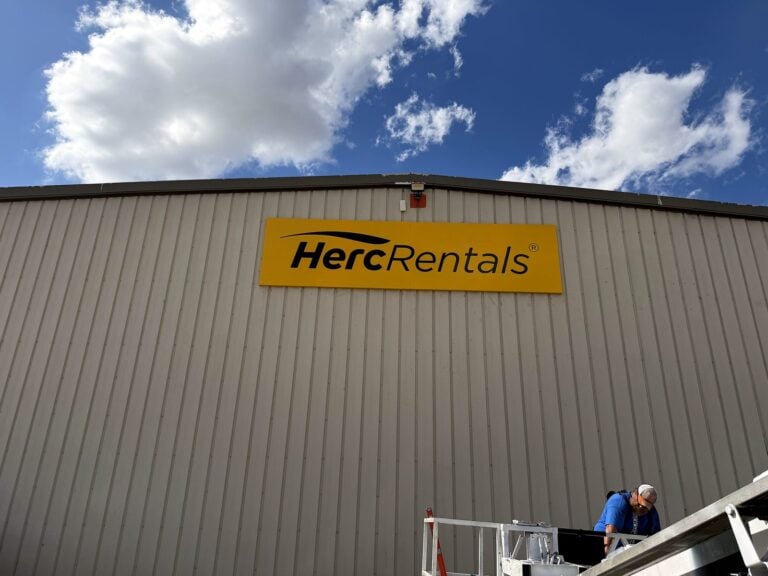 Signature Signs installation crew installing the Herc Rentals sign in Decatur, IL