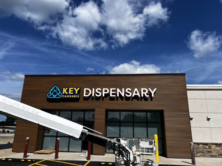 Signature Signs installation crew installing the Key Cannabis Dispensary sign in Mt. Zion, IL