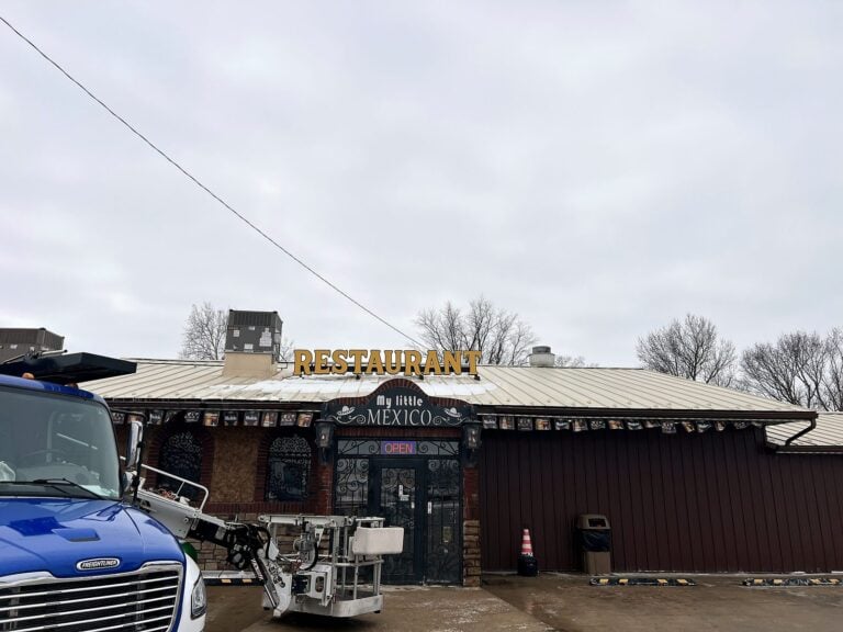 Signature Signs installation crew installing the My Little Mexico sign in Virginia, IL
