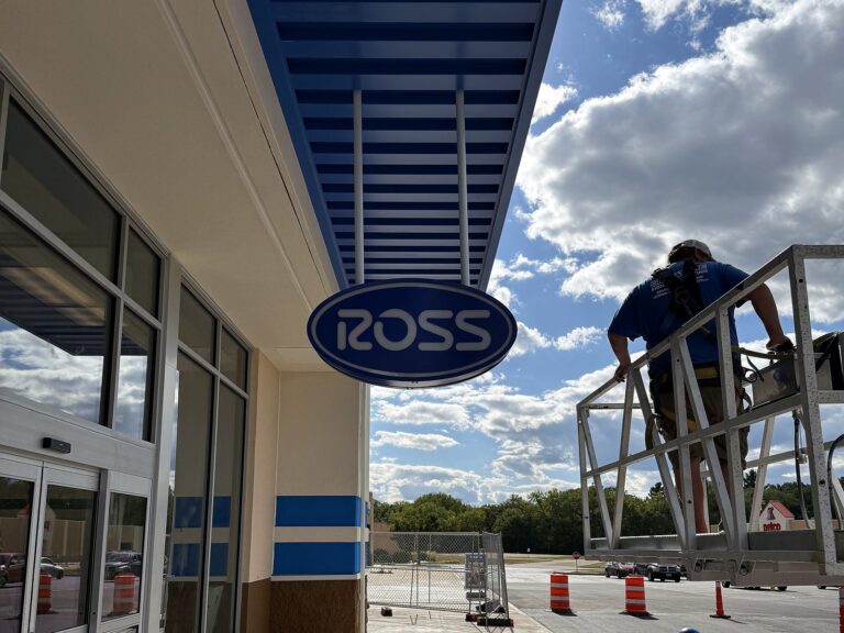 Signature Signs installation crew installing the Ross sign in Pekin, IL