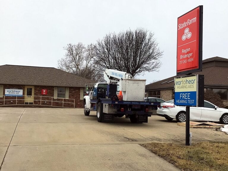 Signature Signs installation crew installing the State Farm - Regan Bruenger sign in Jacksonville, IL