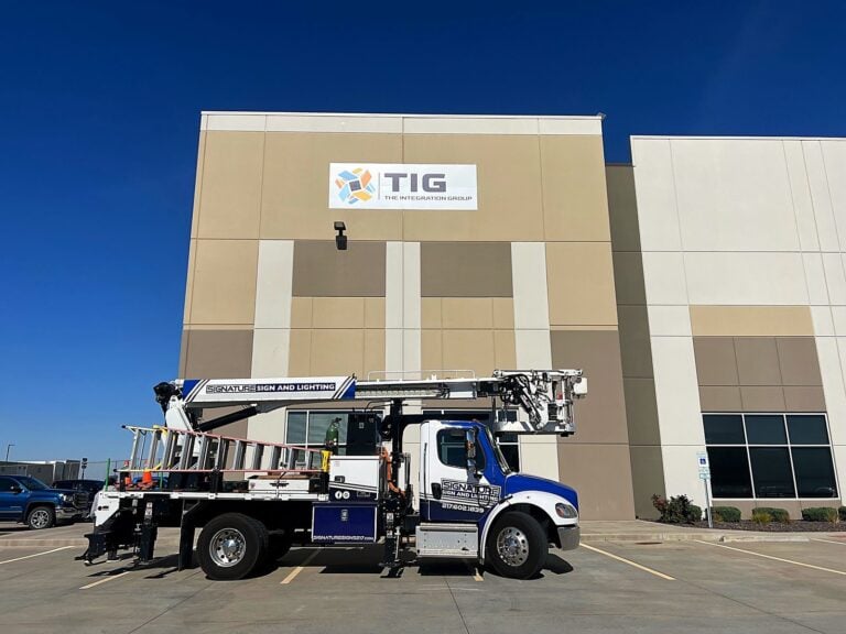 Signature Signs installation crew installing the TIG - The Integration Group sign in Pontoon Beach, IL