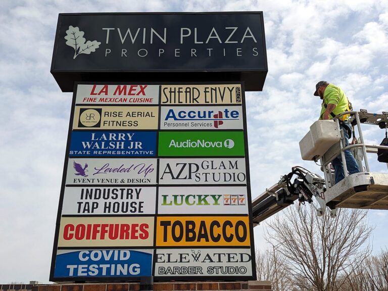 Signature Signs installation crew installing the Twin Plaza Properties sign in Joliet, IL