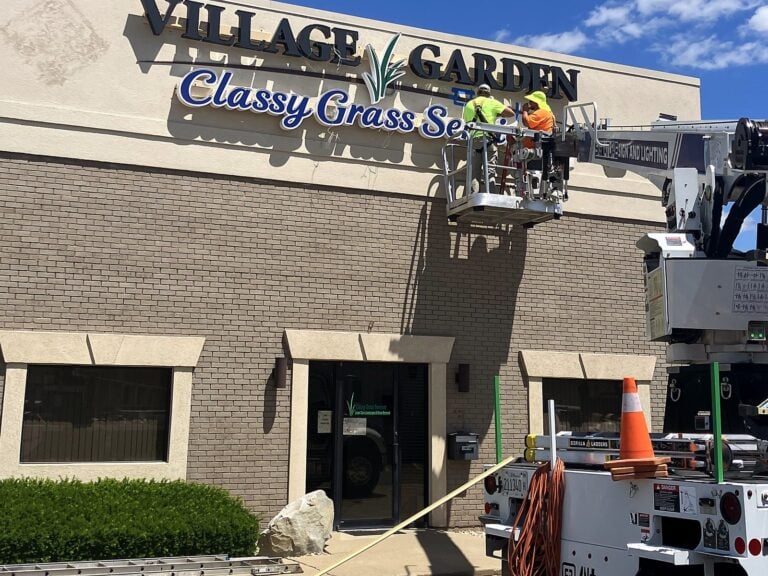 Signature Signs installation crew installing the Village Garden sign in Mt. Zion, IL – view 2