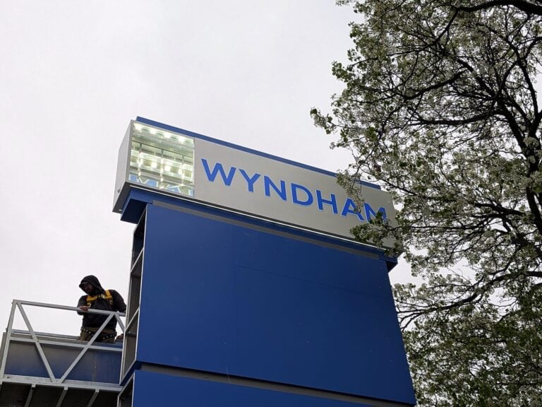 Signature Signs installation crew installing the Wyndham sign